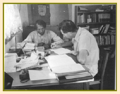 Jake Loewen (right) working on a Bible translation 
